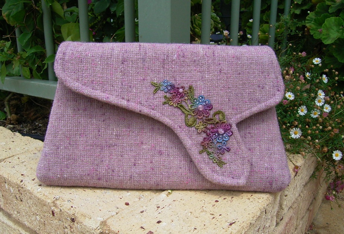 Tweed and lace clutch bag