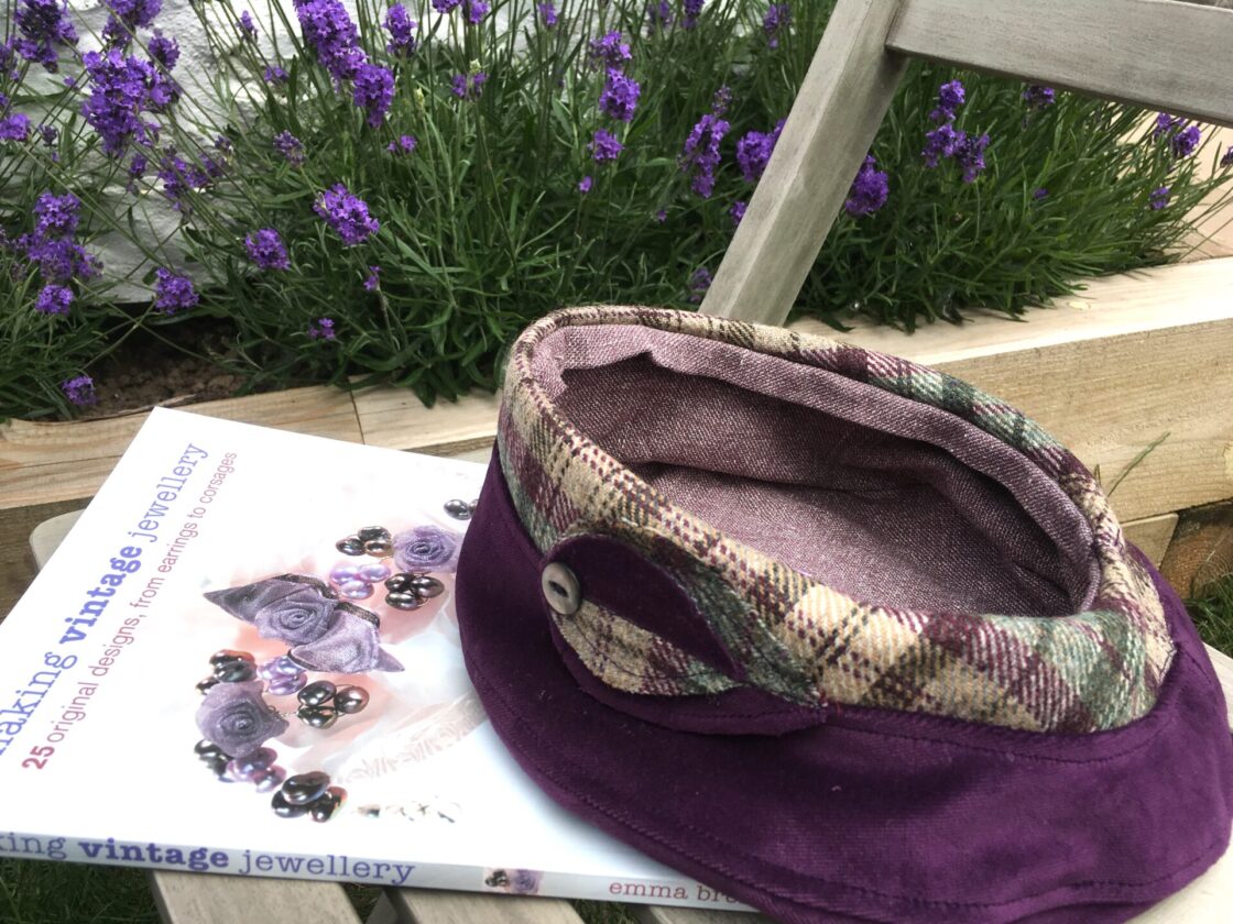 The Lavenham Beret in rich aubergine velvet and plaid wool tweed, lined with linen fabric