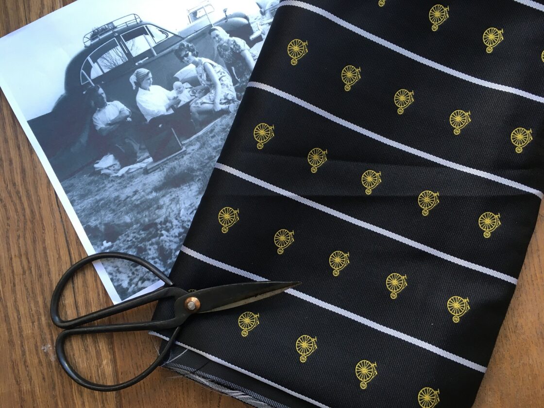 A vintage 'Penny farthing' design is woven into this silk