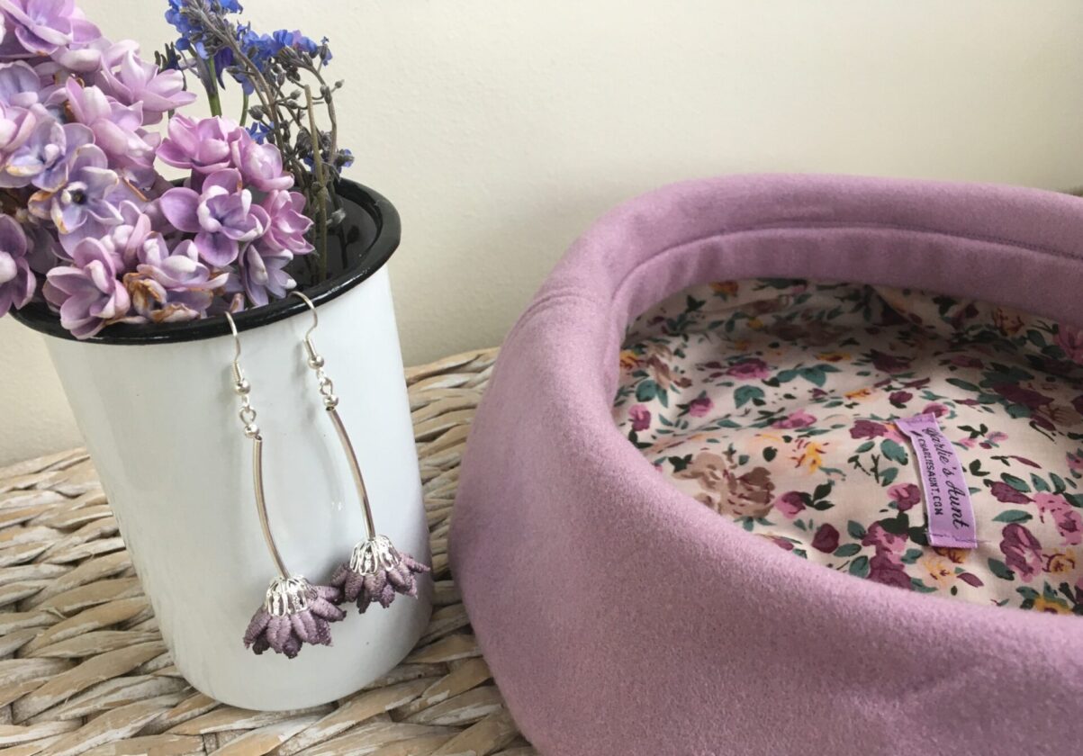 Nedging Beret in a lilac shade with a pair of unique lace flower earrings from Spadger and Sedge
