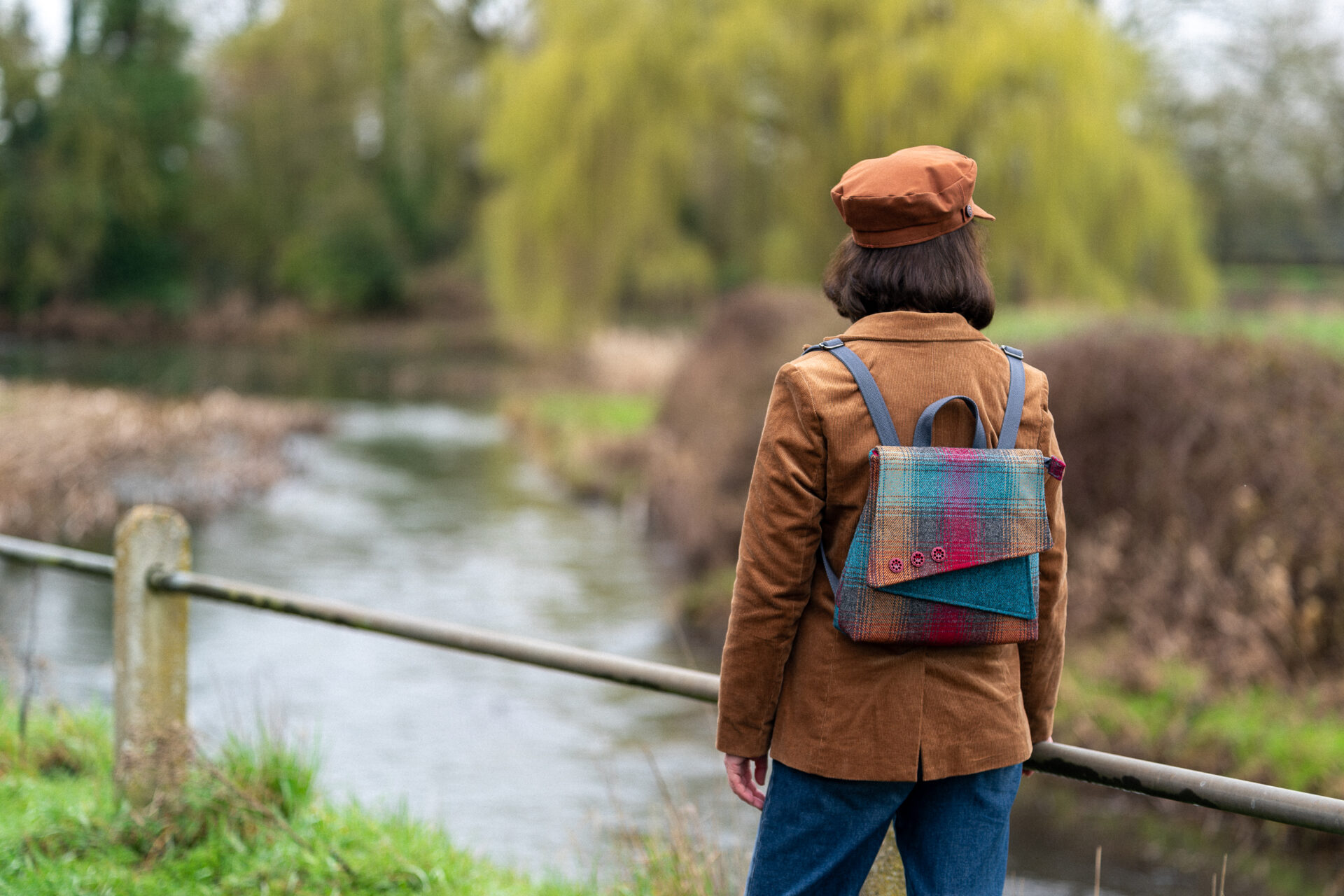 Broadland Backpack PDF sewing pattern modelled by a river in the Suffolk countryside